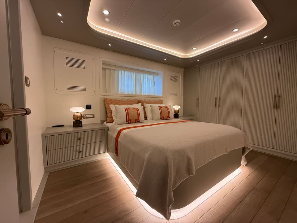 2023 Custom Laminated Motorsailer 41M – guest cabin with double bed, LED cove ceiling, bedside lamps and built-in wardrobes