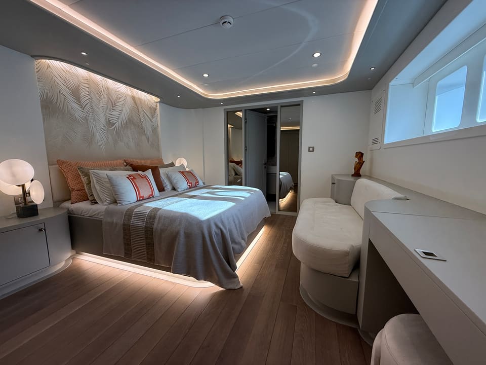 2023 Custom Laminated Motorsailer 41M – master cabin with double bed, LED cove lighting, sofa, vanity desk and hull window