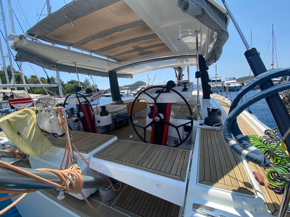 2018 Hanse 548 – twin helm stations with teak cockpit seating under a bimini