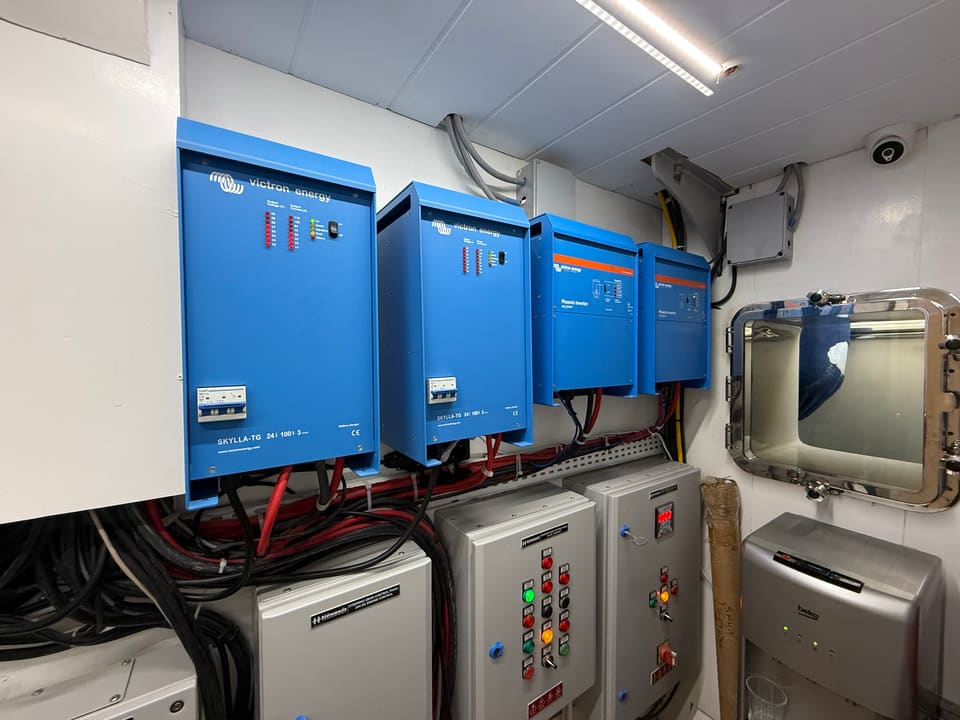 2023 Custom Laminated Motorsailer 41M – technical room with Victron inverter-chargers and electrical control panels