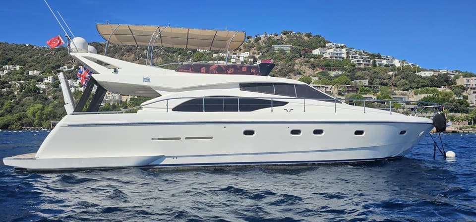 2005 Ferretti 530 – starboard side profile at anchor with flybridge bimini and white hull