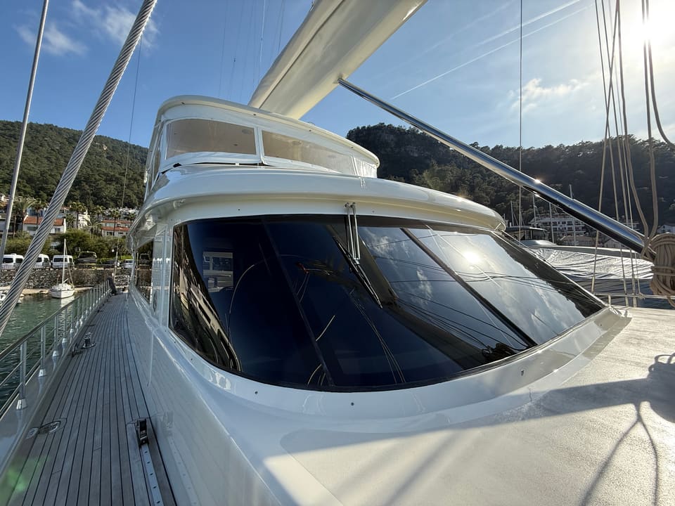 2023 Custom Laminated Motorsailer 41M – side deck with teak decking and tinted wraparound wheelhouse windows