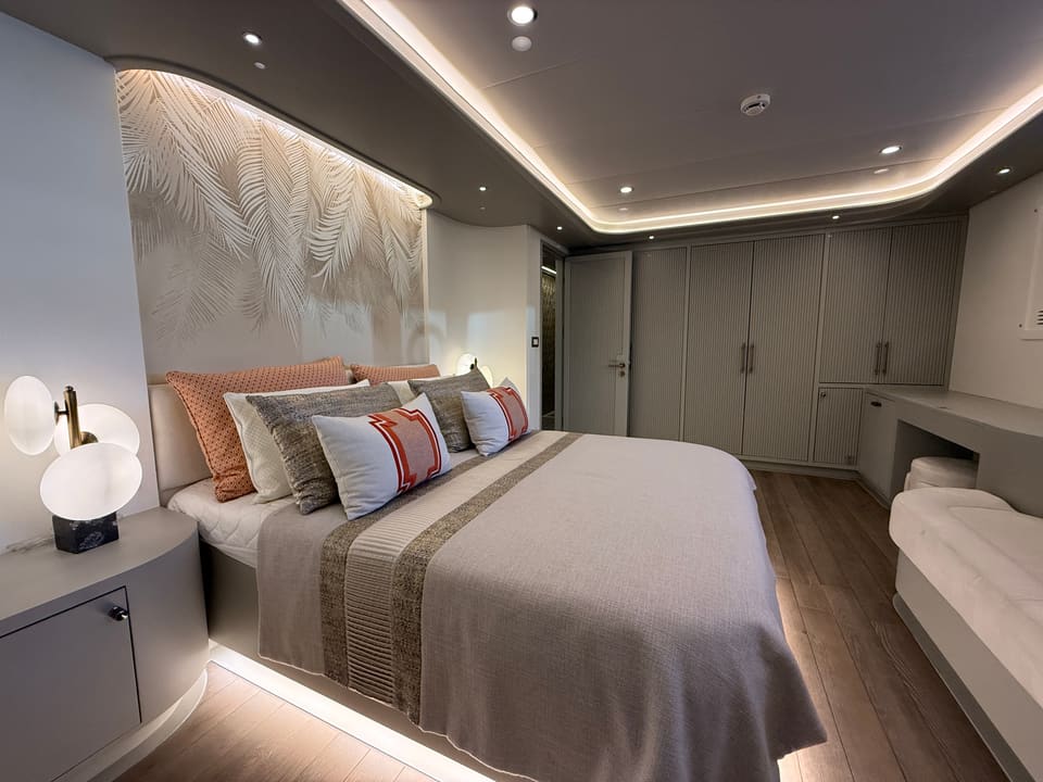 2023 Custom Laminated Motorsailer 41M – guest cabin with double bed, palm-leaf wall mural, LED cove lighting and built-in wardrobes